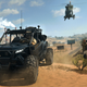 A buggy, chopper, and jeep race across a battlefield.